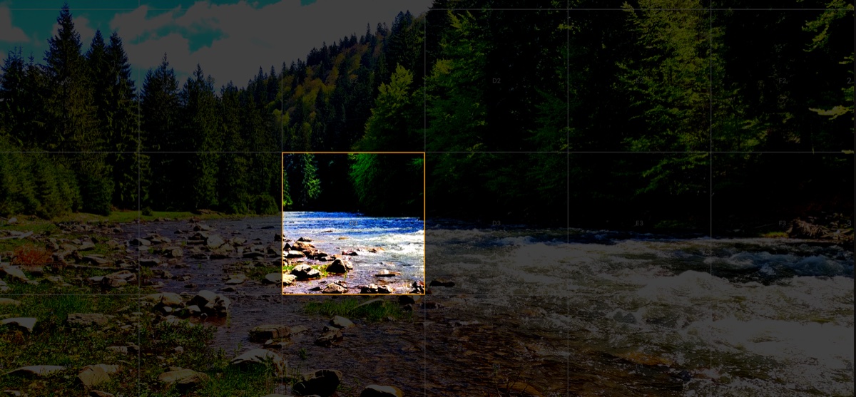 Focus Mode highlighting a single grid cell on a landscape reference photo — surrounding cells are dimmed to isolate the selected area