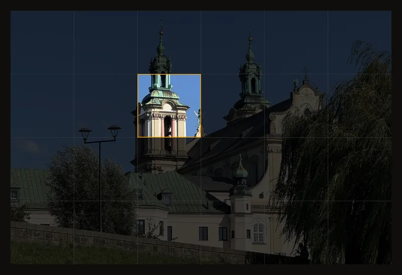 One grid cell shown clearly with an amber border while the rest of the photo is dimmed
