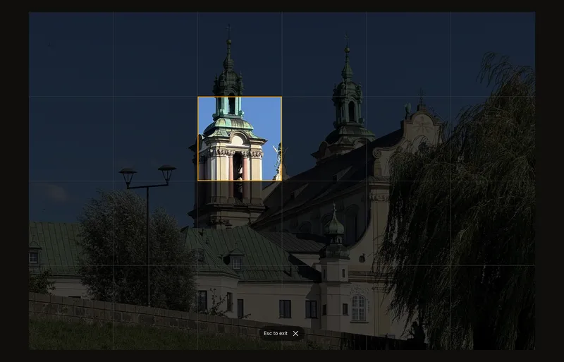 Full screen: the photo with its grid fills the screen, one cell is focused, and a small hint says how to exit